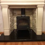 Multi fuel stove in marble inset and large marble mantle